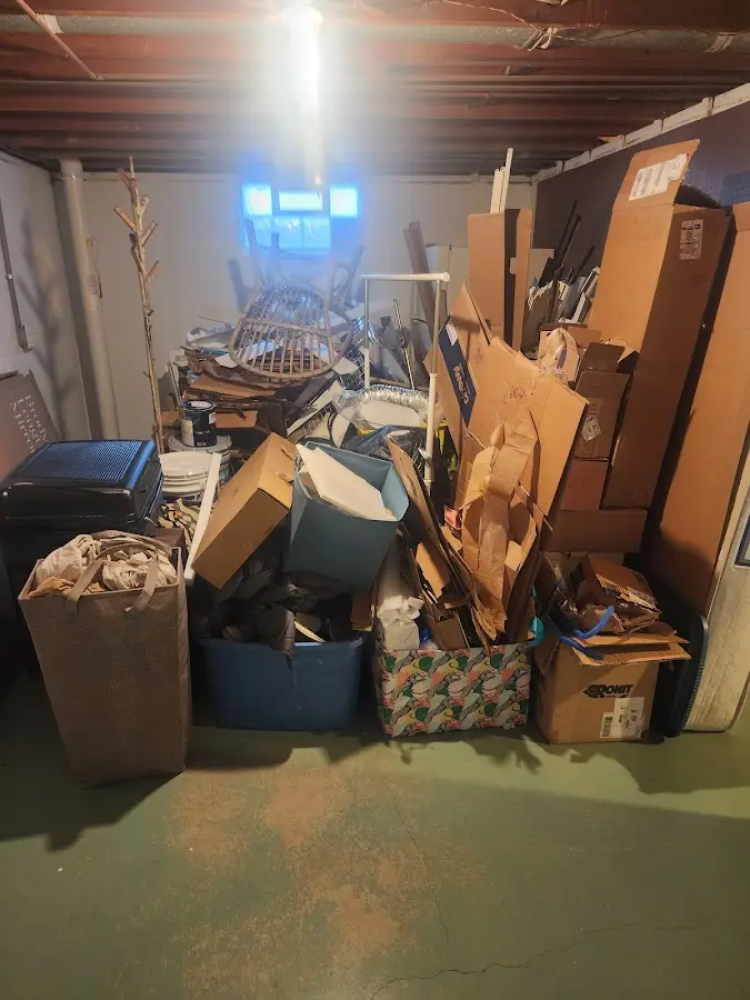 Roll-off dumpster container at job site for 2 Yard Dumpster Rental in Farmington